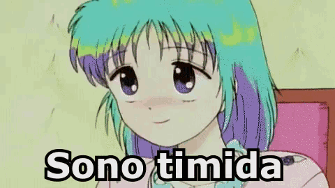 a cartoon girl with green hair and purple eyes is sitting on a bed with the words sono timida written below her .