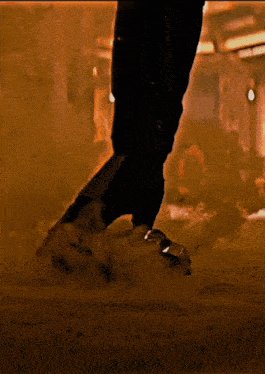 a close up of a person 's feet with a smoke coming out of them