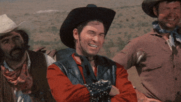 a man in a cowboy hat is making a funny face with his arms crossed