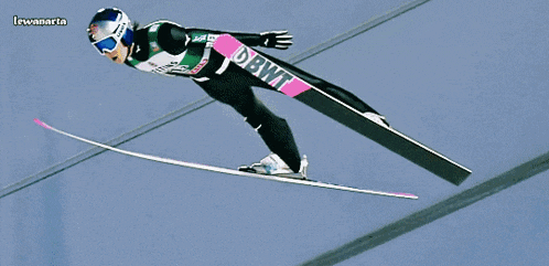 a ski jumper with the word dbwt on the front of his outfit