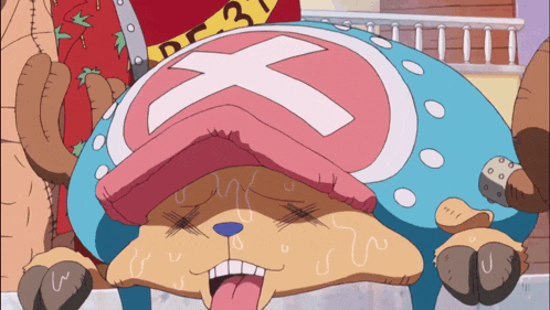 a tony tony chopper from one piece is laying down with his tongue out