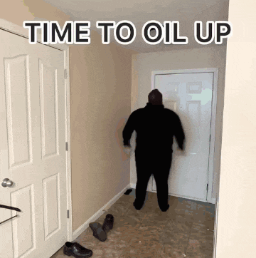 a man is standing in a hallway with the words time to oil up written above him