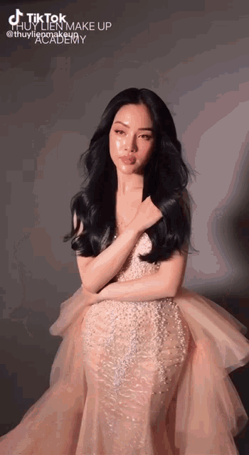 a woman in a long dress with the words tiktok makeup