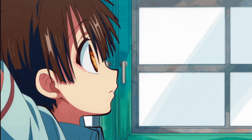 a young boy looking out a window with a blue frame