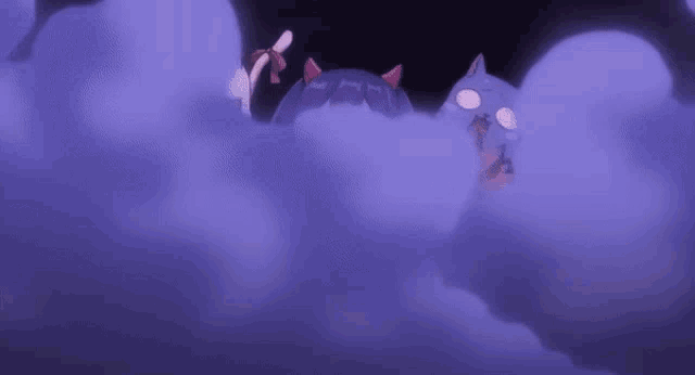 a couple of cats are standing in a purple cloud .