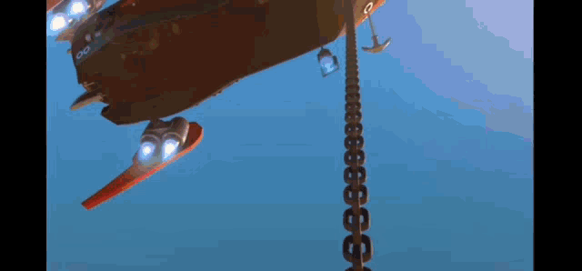 a space ship is being lifted by a chain with the letters c and o on it