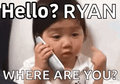 a baby is talking on a cell phone and making a face .