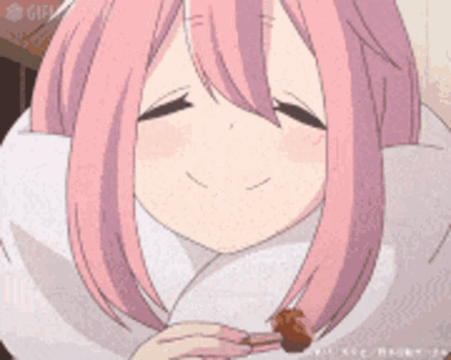a girl with pink hair is holding a piece of food