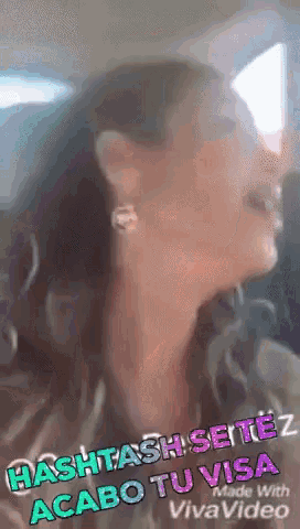 a close up of a woman 's face with the words " acaba tu visa " on the bottom right