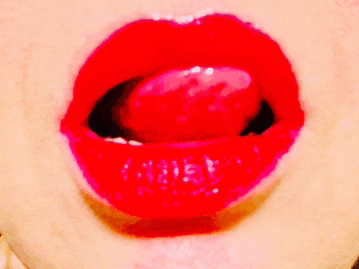a close up of a person 's mouth with red lips and a tongue sticking out