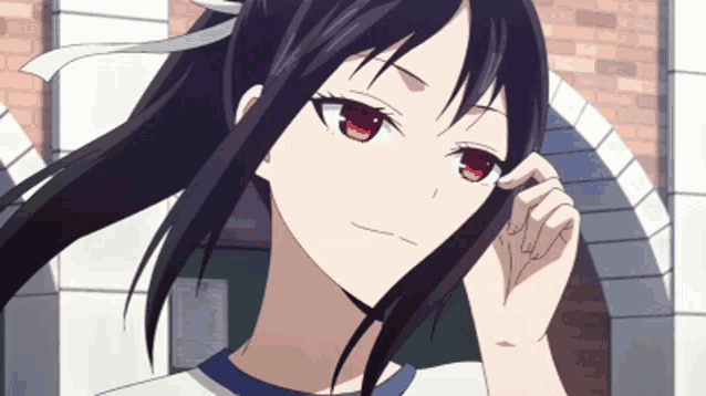 a girl with black hair and red eyes is looking at the camera