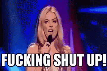 a woman speaking into a microphone with the words fucking shut up above her