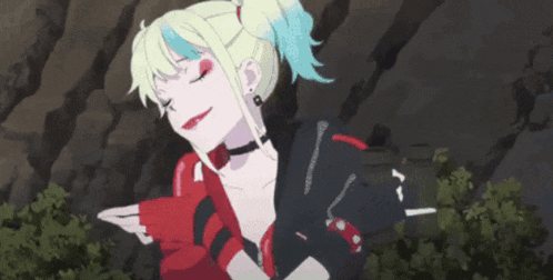 a girl with blonde hair and blue eyes is wearing a black jacket and red gloves and a choker .
