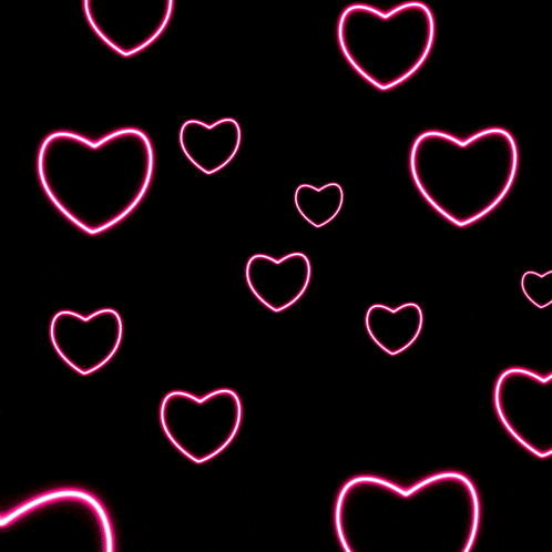a glowing pink heart surrounded by smaller hearts on a black background