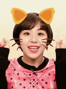 a girl wearing a pink shirt that says twice