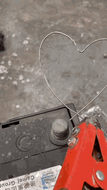 a heart shaped fire is being lit up by a fuse box