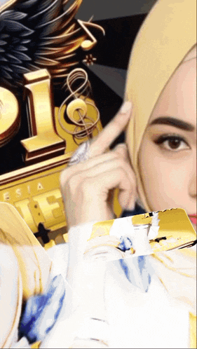 a woman wearing a hijab is pointing at something in front of a gold letter l