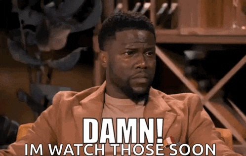 a man is sitting in a chair with the words damn im watch those soon on his face