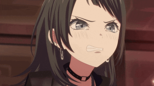a girl wearing a choker and earrings looks angry