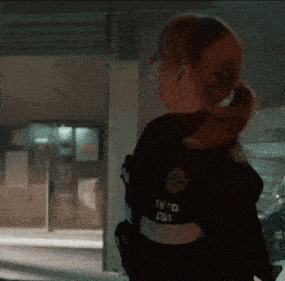 a woman in a ponytail is wearing a uniform that says iv / d