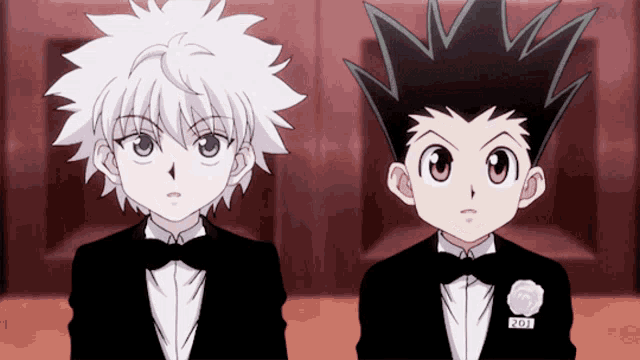 two anime characters are standing next to each other and one has a pin that says 201
