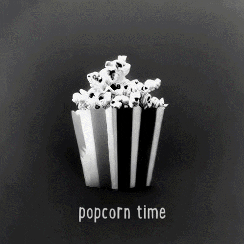 a black and white photo of a bucket of popcorn with the words " popcorn time " written below it