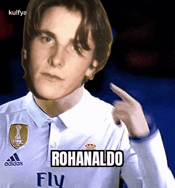 a young man wearing a white adidas shirt is pointing at himself