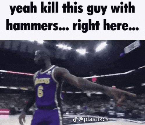 a basketball player in a purple jersey with the number 6 on it is pointing at something .