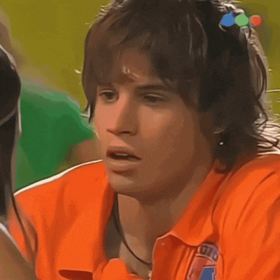 a young man wearing an orange shirt that says rio on it