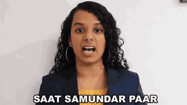 a woman in a blue jacket and yellow top says saat samundar paar
