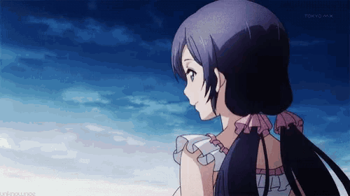 a girl with long black hair is looking at the sky