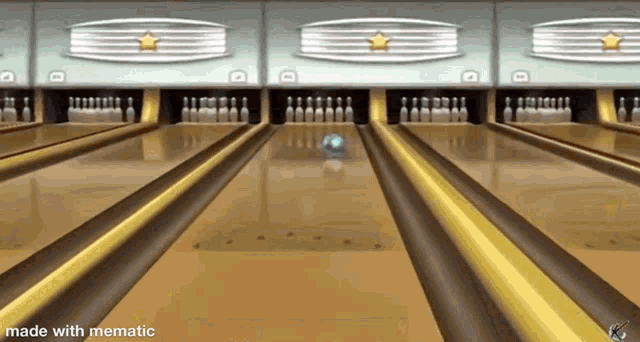 a bowling alley with bowling pins and a bowling ball going down the lanes