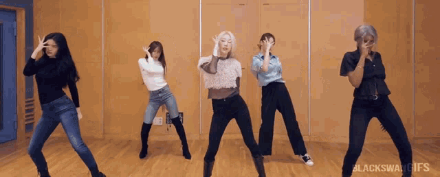 a group of women are dancing in a room with the words blackswan gifs on the bottom