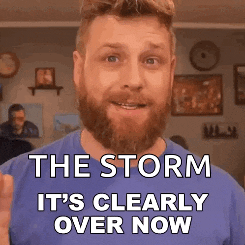 a man with a beard and a blue shirt says the storm it 's clearly over now