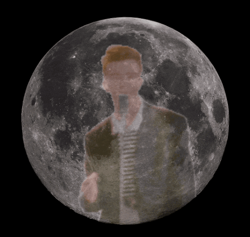 a man in a suit and tie is standing in front of a full moon