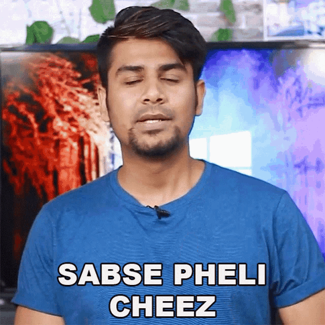 a man wearing a blue shirt says sabse pheli cheez