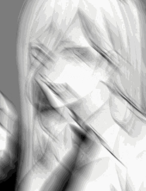 a blurry picture of a woman 's face with long hair