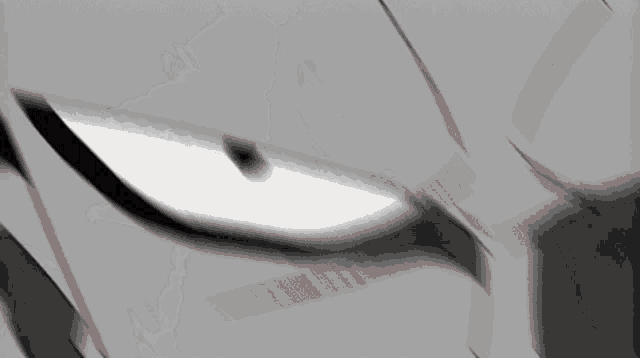 a close up of a cartoon character 's eye with a red stripe on it