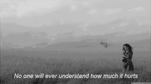 a black and white photo of a woman in a field with a quote .