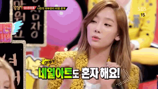 a woman in a yellow jacket is on a sbs channel