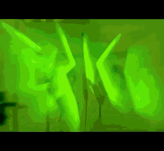 a green background with a person 's face in the middle