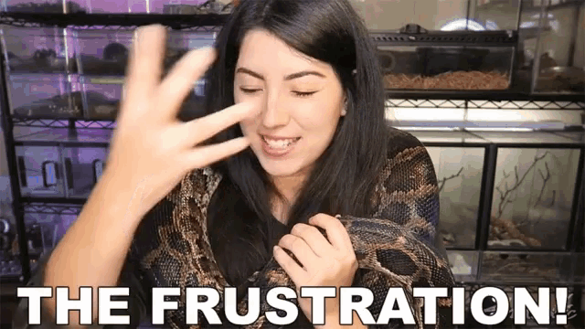 a woman holding a snake with the words " the frustration " behind her