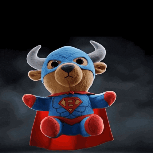 a stuffed bull wearing a mask and cape with the letters lfg behind it
