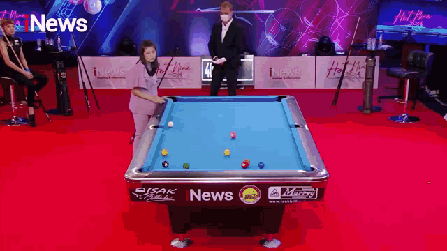 a pool table with the word news on the side