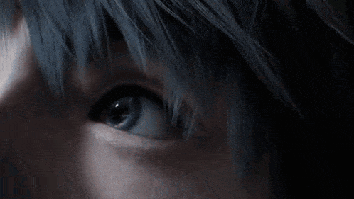 a close up of a person 's eye with a blue background