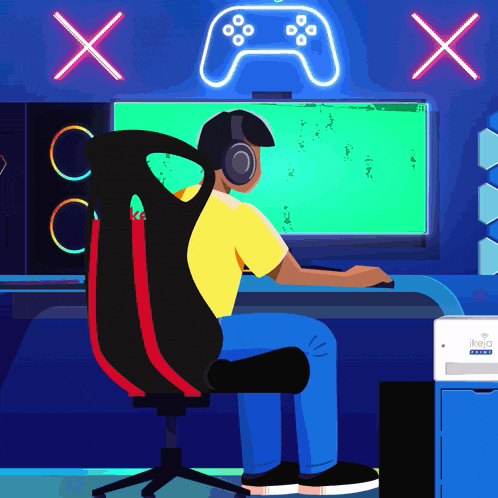 a man wearing headphones is sitting in front of a computer