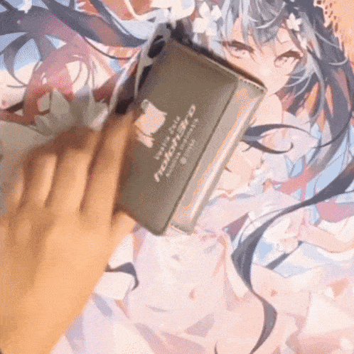 a person is holding a wallet that has the word holohero on it