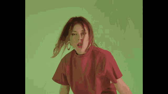 a woman wearing a red crop top with the word crop on the waistband