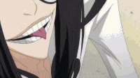 a close up of a person 's face with their tongue out .