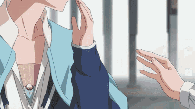 a person touching another person 's face with their finger